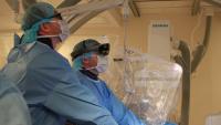 Two doctors perform an operation